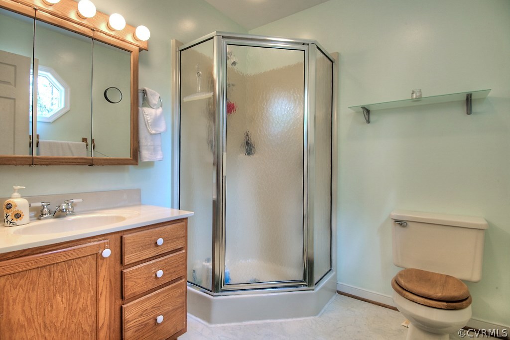 17516 Old Ridge Road Montpelier, VA 23192 - Photo 18 of 27 a bathroom with a granite countertop sink toilet and shower
