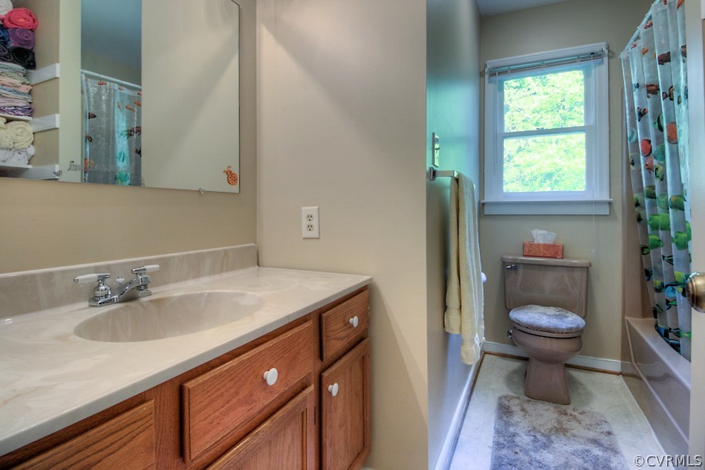 17516 Old Ridge Road Montpelier, VA 23192 - Photo 19 of 27 a bathroom with a sink toilet and a mirror