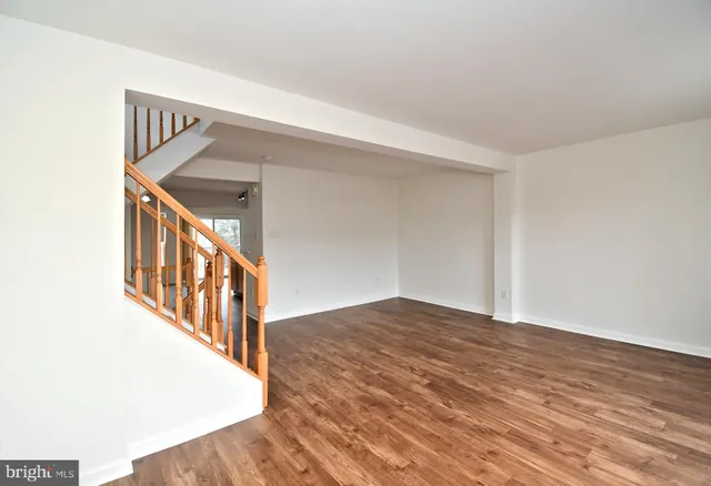 a kitchen with stainless steel appliances granite countertop a stove and a refrigerator