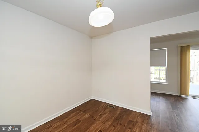 a kitchen with stainless steel appliances granite countertop sink refrigerator and microwave