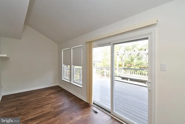 a utility room with a shower and a sink