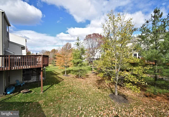 a bathroom with a sink vanity mirror and toilet