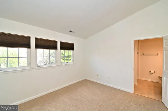 a view of a balcony with wooden floor
