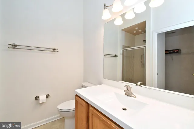 a view of a house with a wooden deck