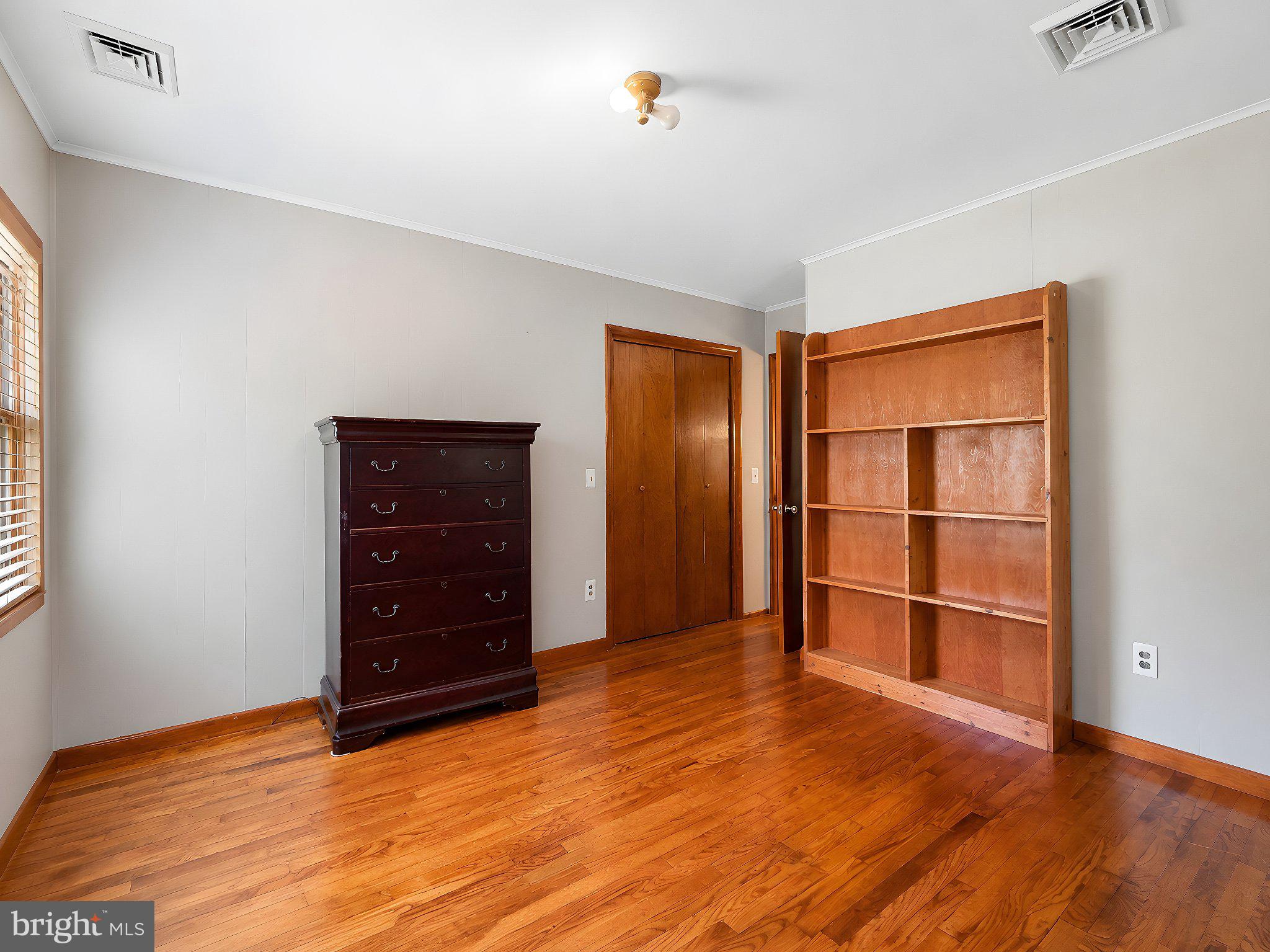 13315 Point Lookout Road Ridge, MD 20680 - Photo 33 of 51 Spacious room with warm wood accents.