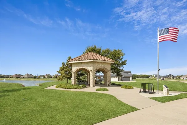 a view of a garden with a house