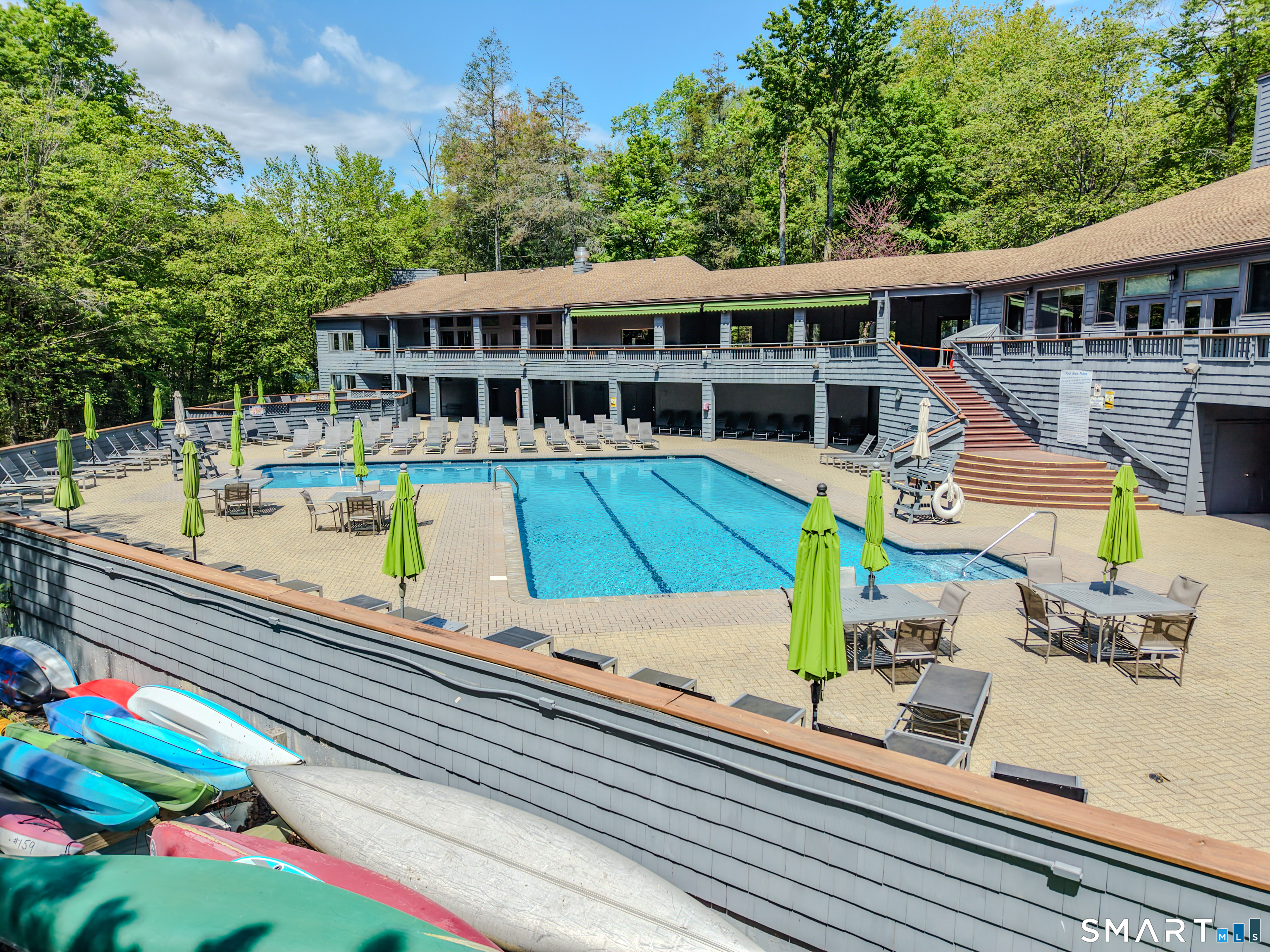 39 Evergreen Road, Unit 39 Torrington, CT 06790 - Photo 18 of 27 a view of a house with a swimming pool