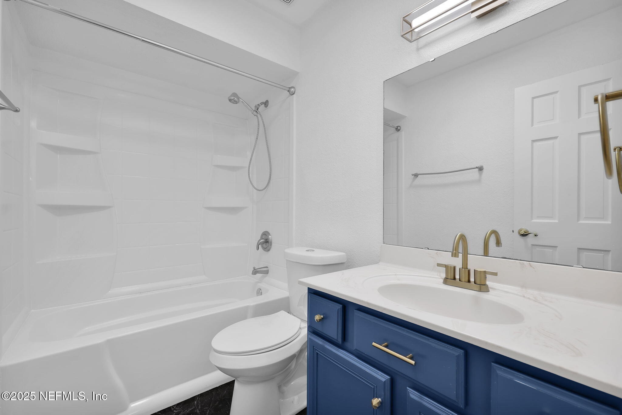 5455 Spring Brook Road Jacksonville, FL 32277 - Photo 12 of 21 a bathroom with a sink a toilet and a bathtub