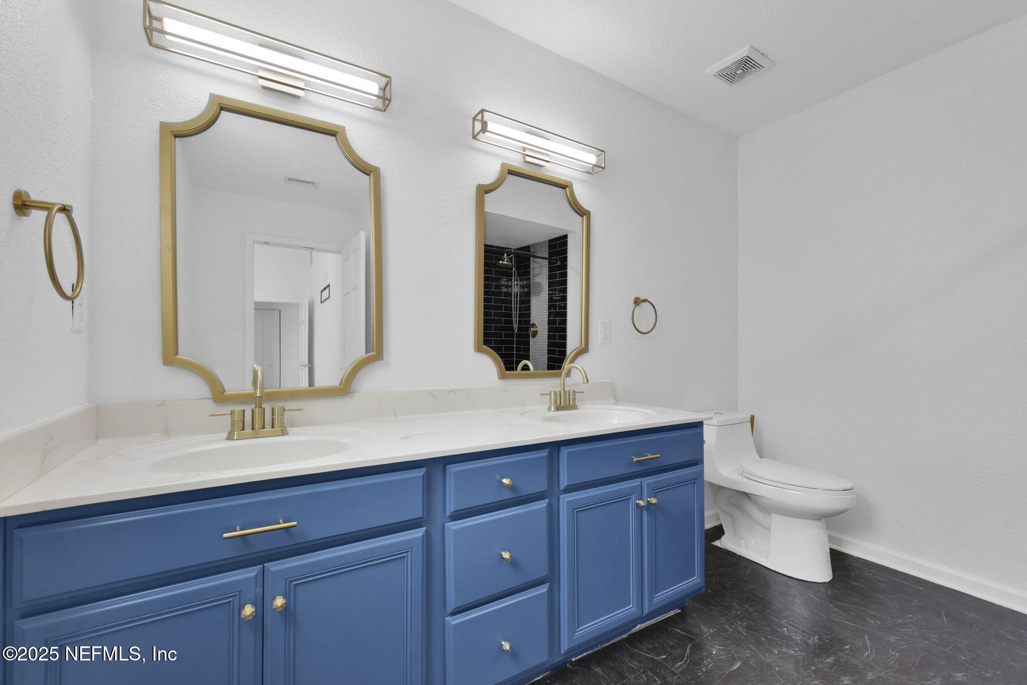5455 Spring Brook Road Jacksonville, FL 32277 - Photo 13 of 21 a bathroom with a double vanity sink and a mirror