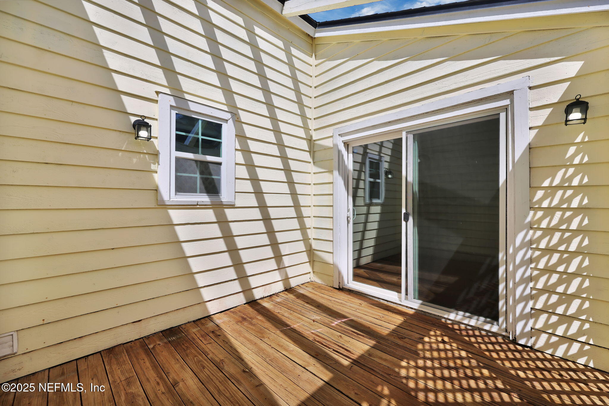 5455 Spring Brook Road Jacksonville, FL 32277 - Photo 15 of 21 a view of a house with a door and wooden floor