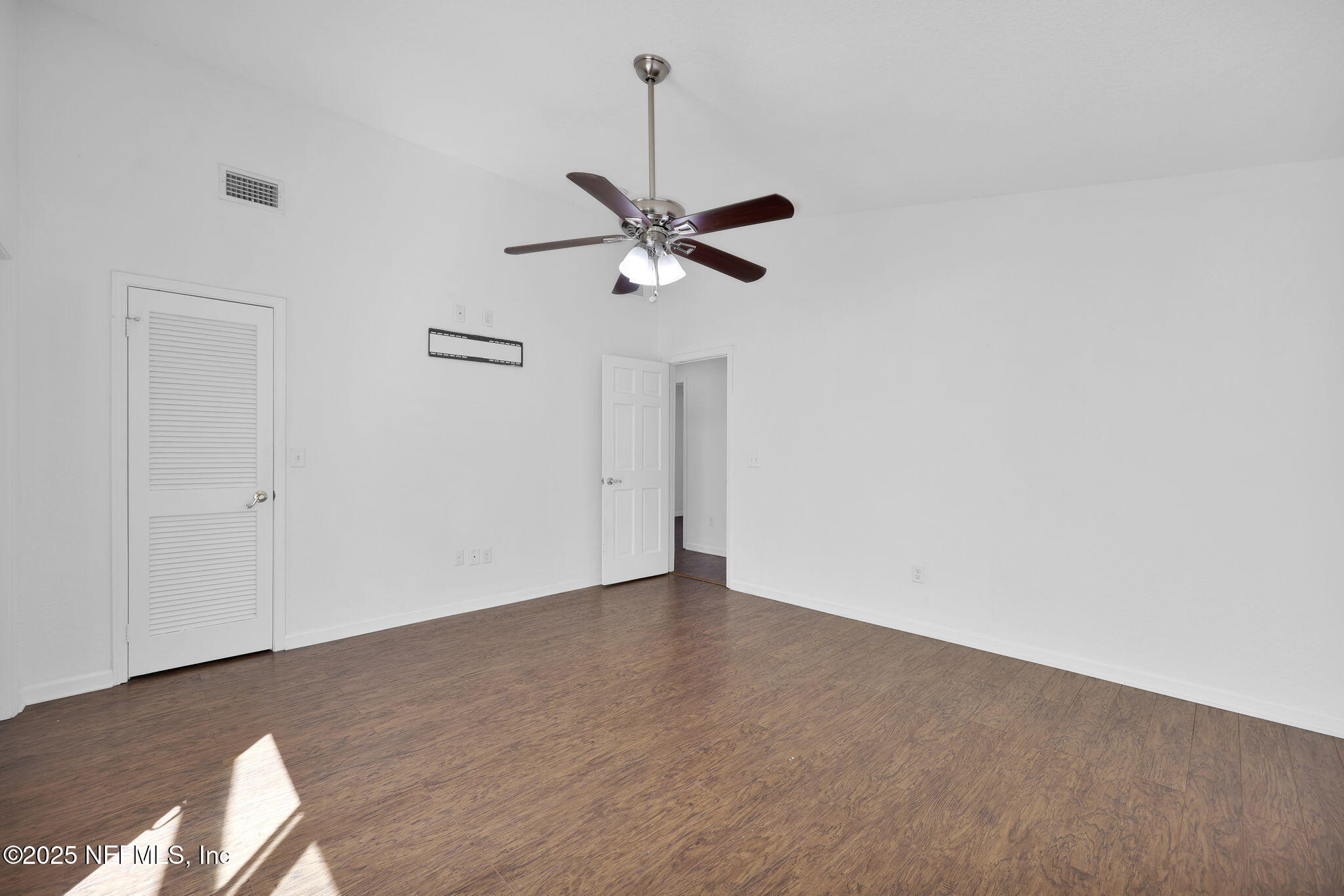 5455 Spring Brook Road Jacksonville, FL 32277 - Photo 18 of 21 a view of an empty room with a ceiling fan