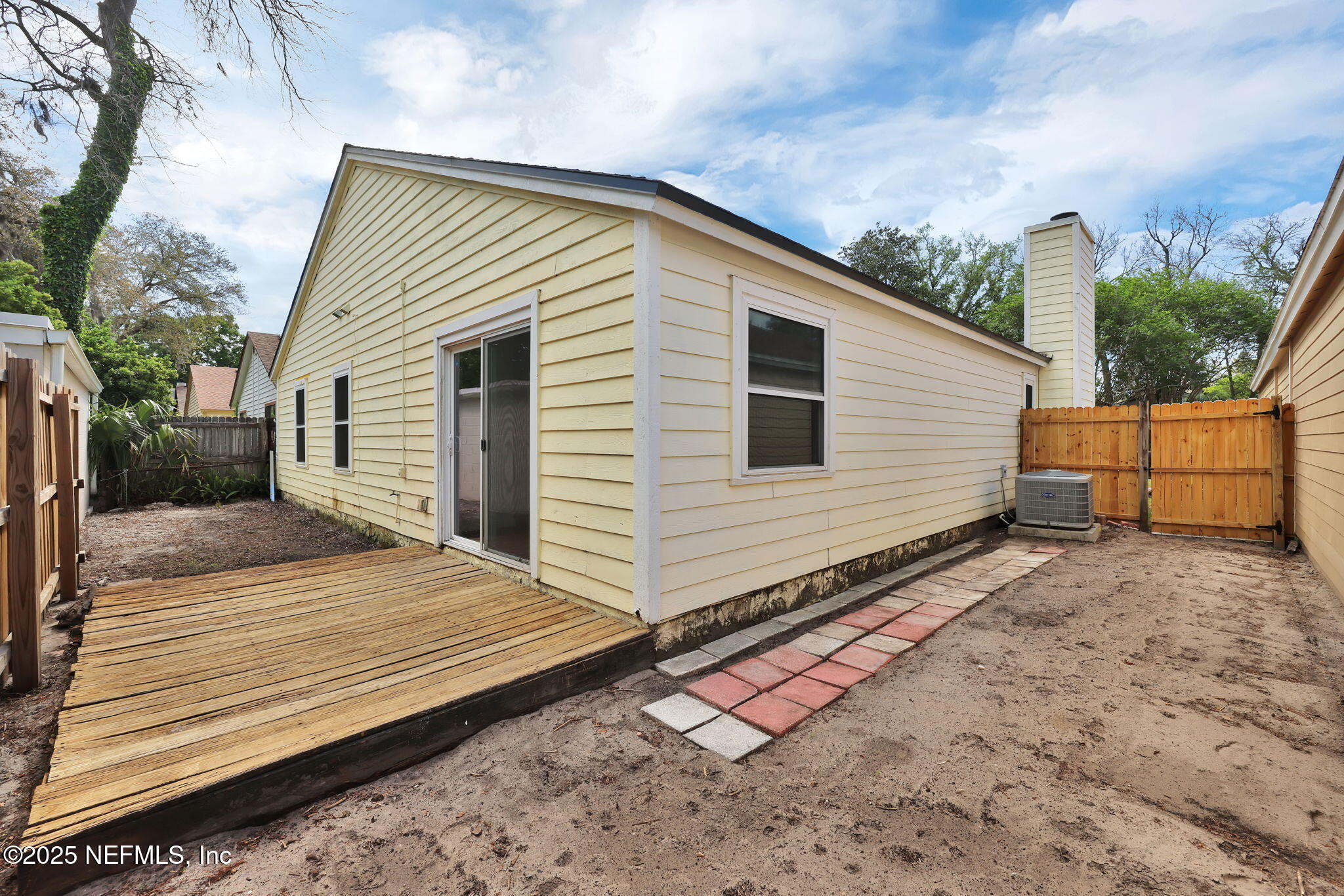 5455 Spring Brook Road Jacksonville, FL 32277 - Photo 19 of 21 a view of a house with a yard