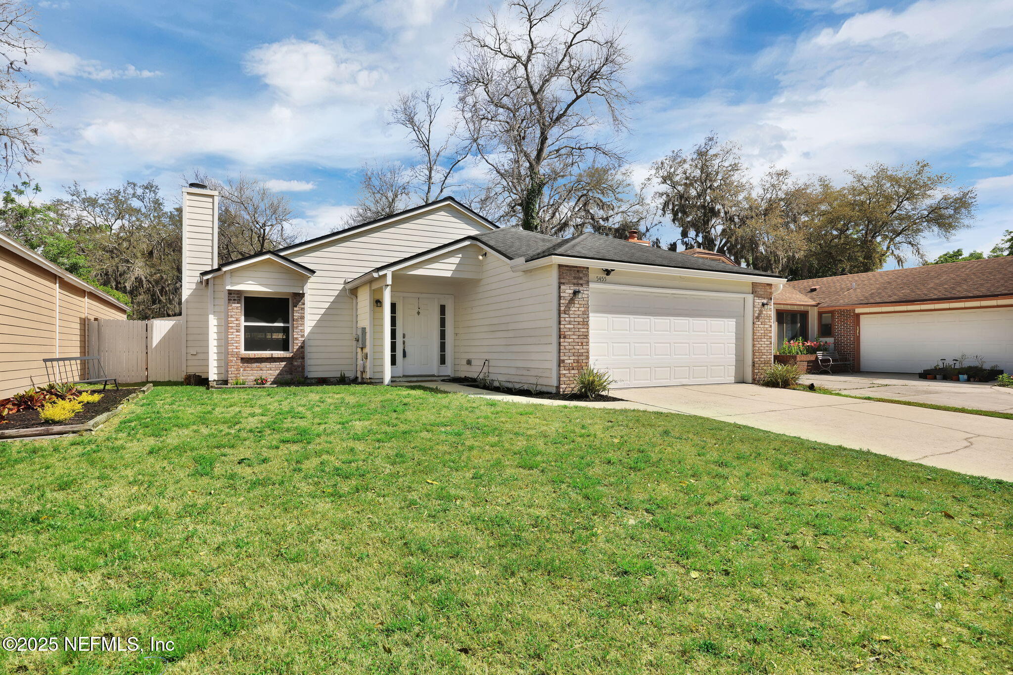 5455 Spring Brook Road Jacksonville, FL 32277 - Photo 2 of 21 a view of a house with a yard