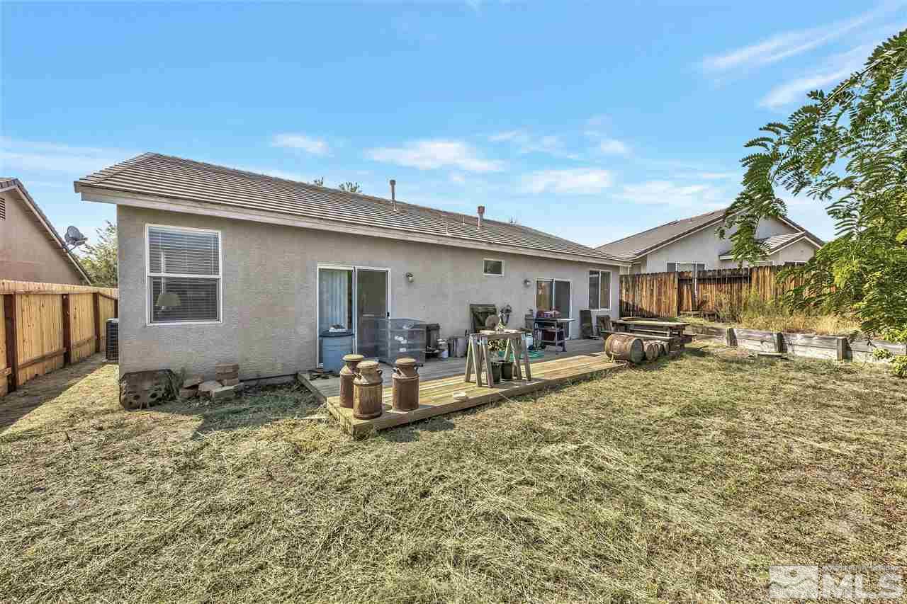 10680 Arbor Way Reno, NV 89521 - Photo 14 of 16 a view of a house with backyard and sitting area