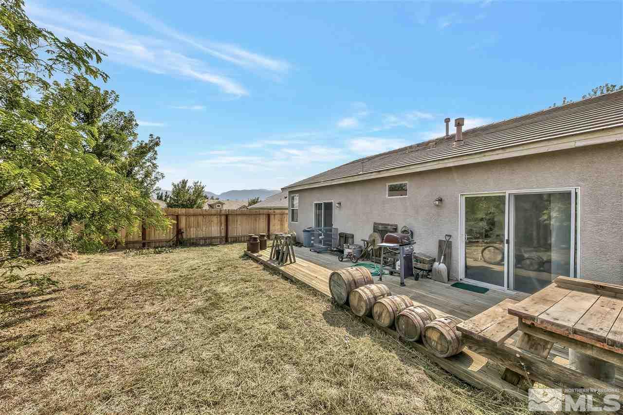 10680 Arbor Way Reno, NV 89521 - Photo 15 of 16 a view of a backyard with furniture and floor to ceiling window