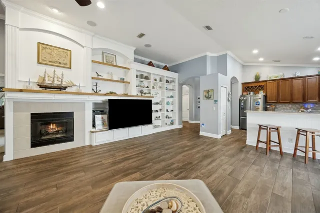 a view of a dining room with furniture and wooden floor