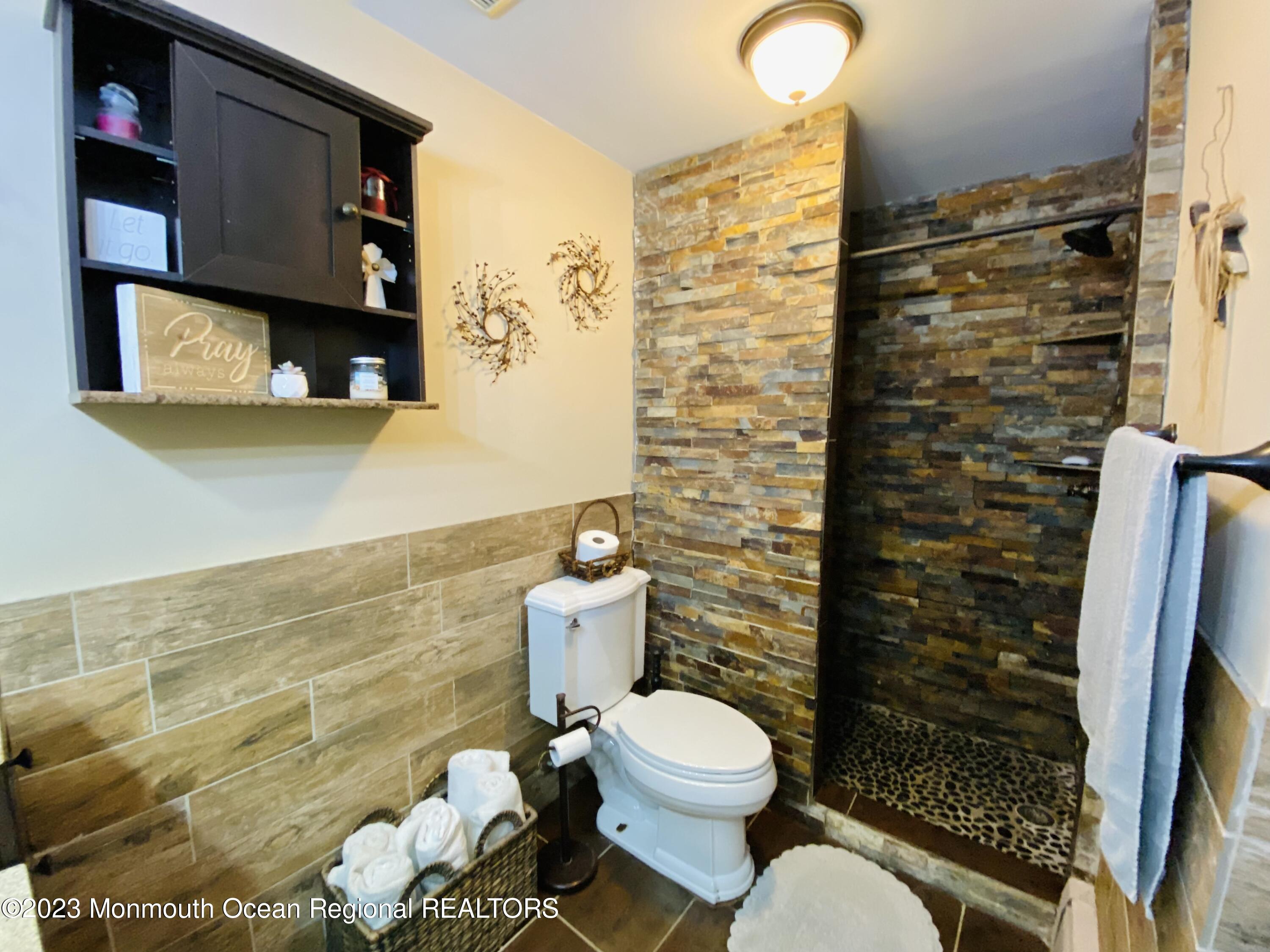 113 Maple Avenue Tuckerton, NJ 08087 - Photo 15 of 69 a bathroom with a toilet and a shower