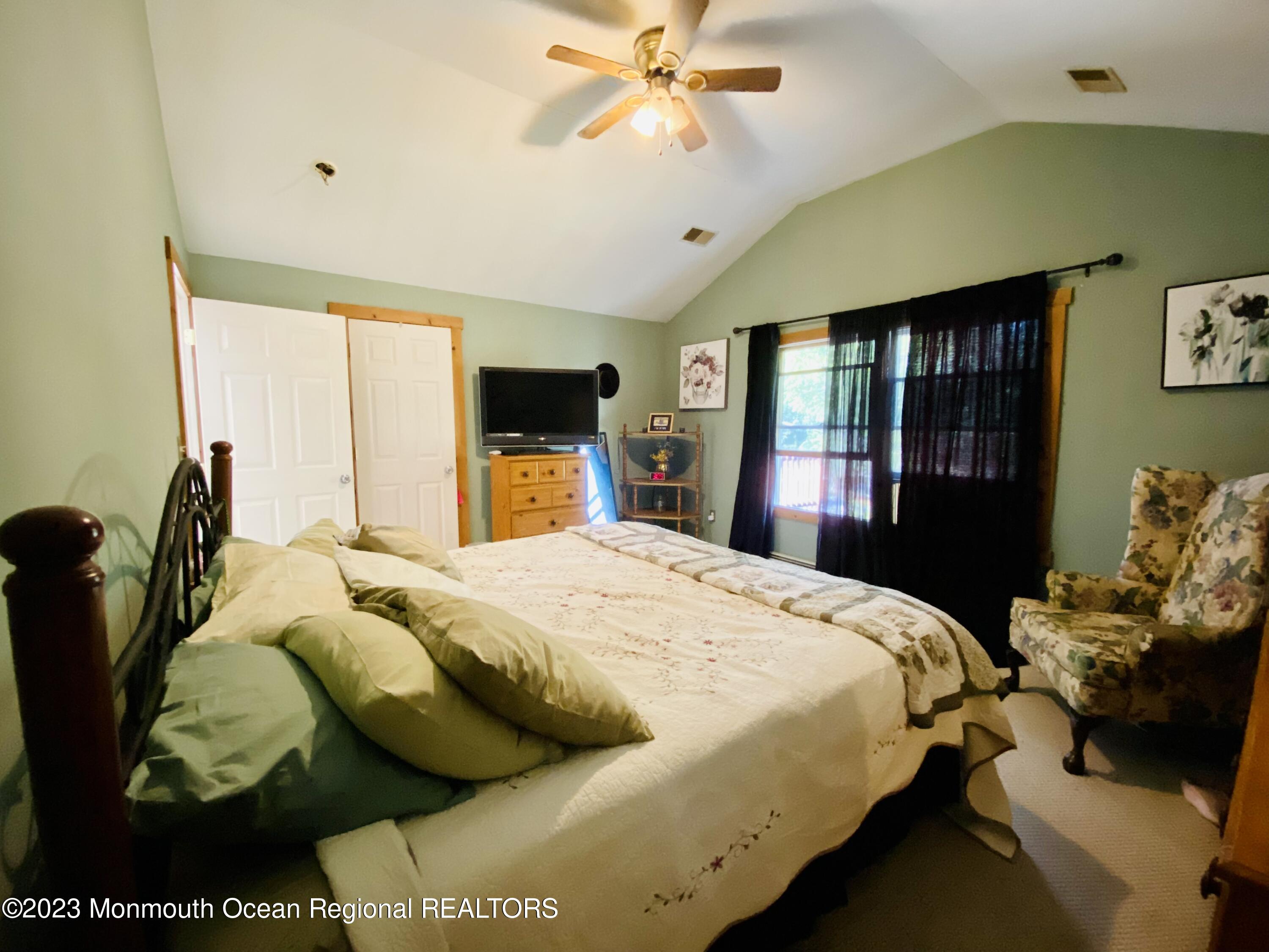 113 Maple Avenue Tuckerton, NJ 08087 - Photo 28 of 69 a bedroom with a bed and dresser with mirror