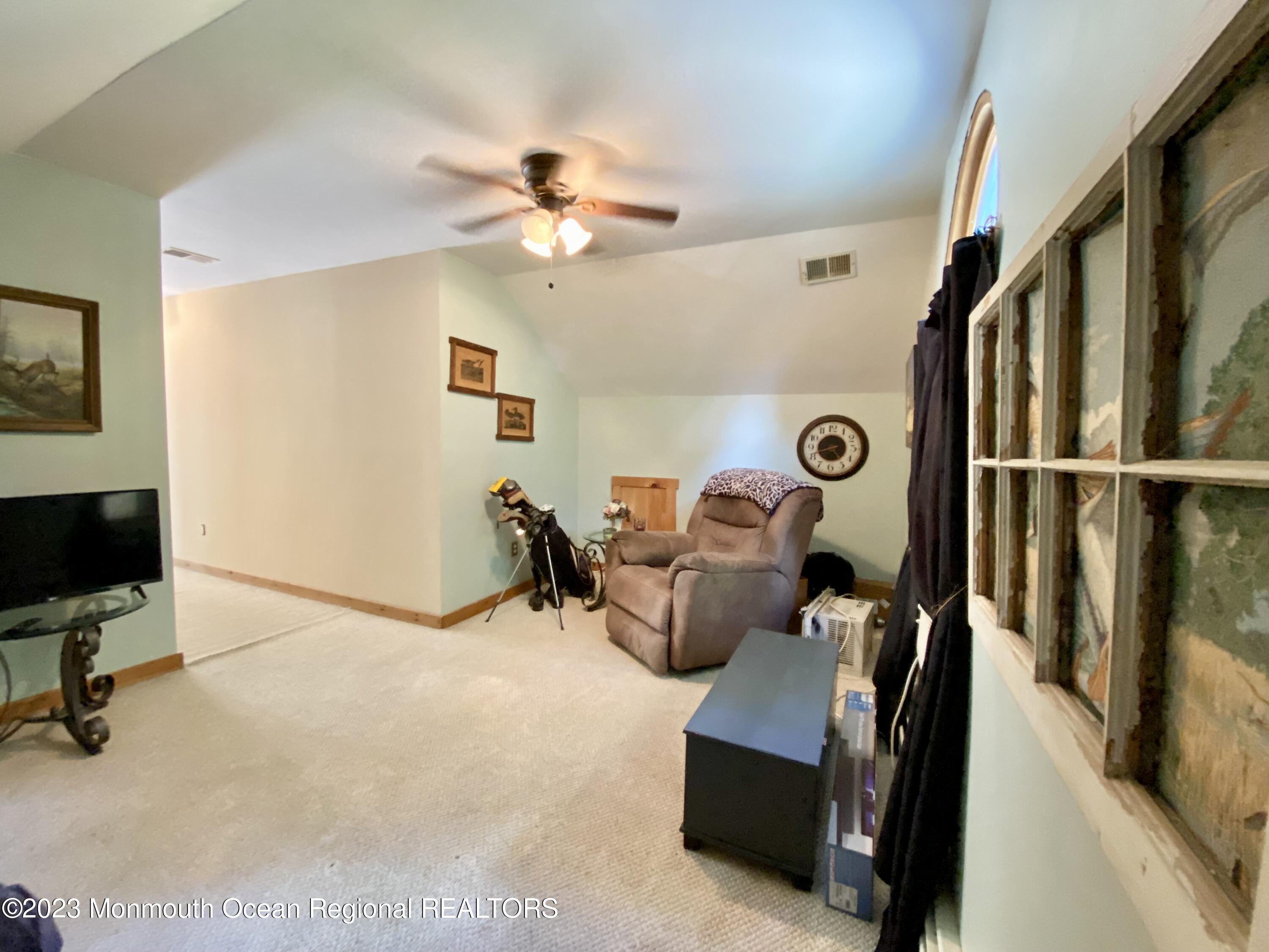113 Maple Avenue Tuckerton, NJ 08087 - Photo 31 of 69 a view of a livingroom with furniture and a ceiling fan