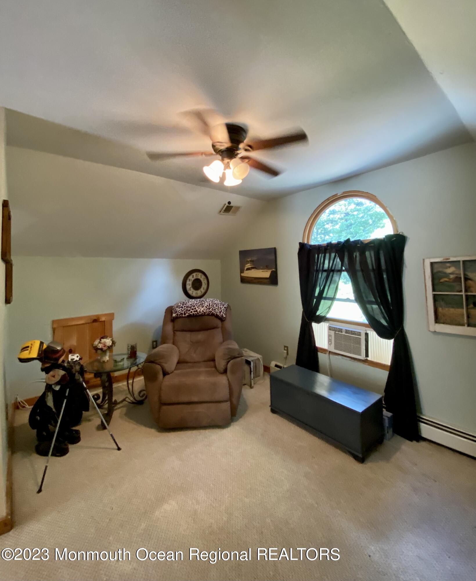 113 Maple Avenue Tuckerton, NJ 08087 - Photo 32 of 69 a living room with furniture and a chandelier