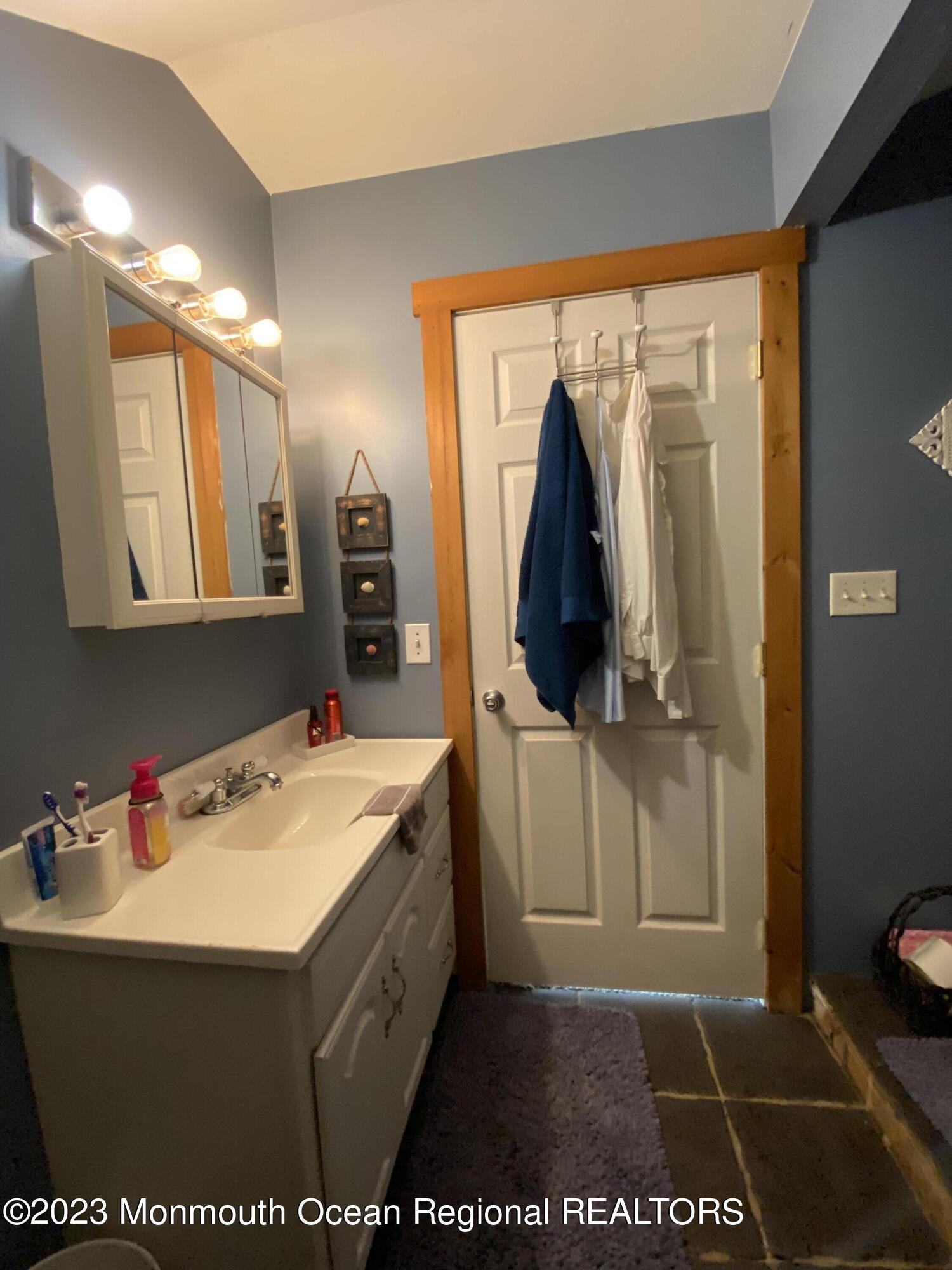 113 Maple Avenue Tuckerton, NJ 08087 - Photo 36 of 69 a bathroom with a sink and a mirror