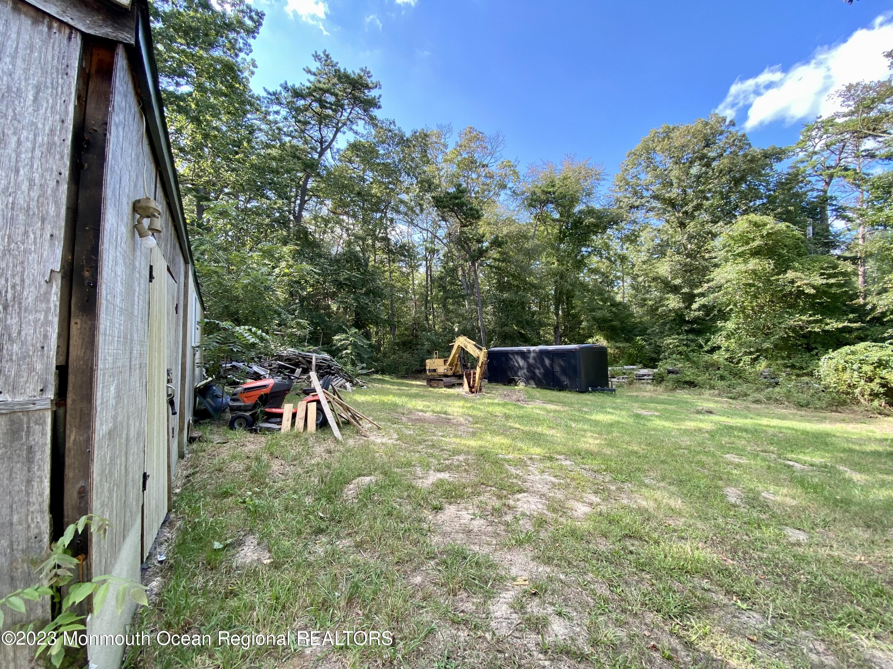 113 Maple Avenue Tuckerton, NJ 08087 - Photo 45 of 69 a backyard of a house with table and chairs