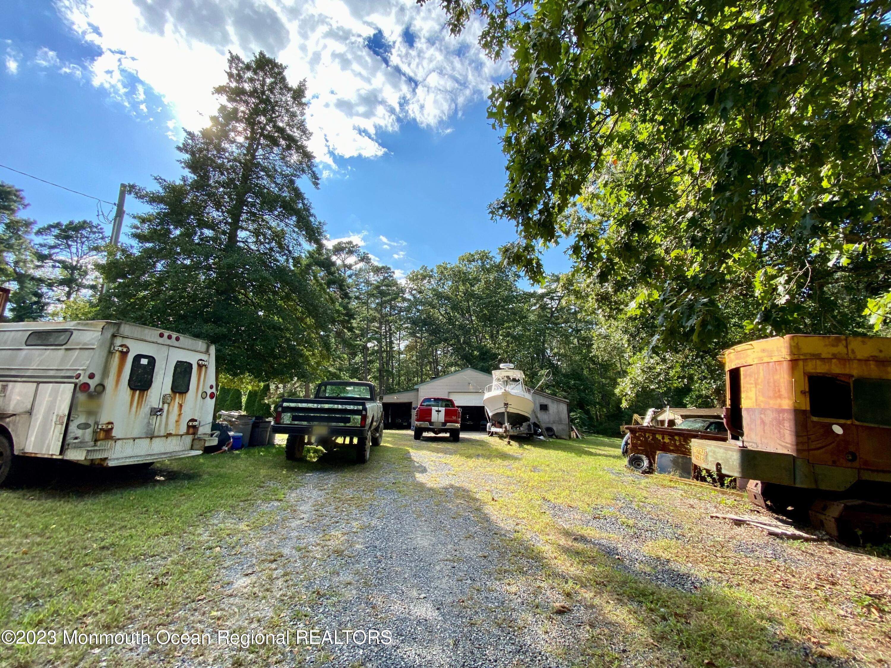 113 Maple Avenue Tuckerton, NJ 08087 - Photo 46 of 69 a car parked in front of a house with cars parked