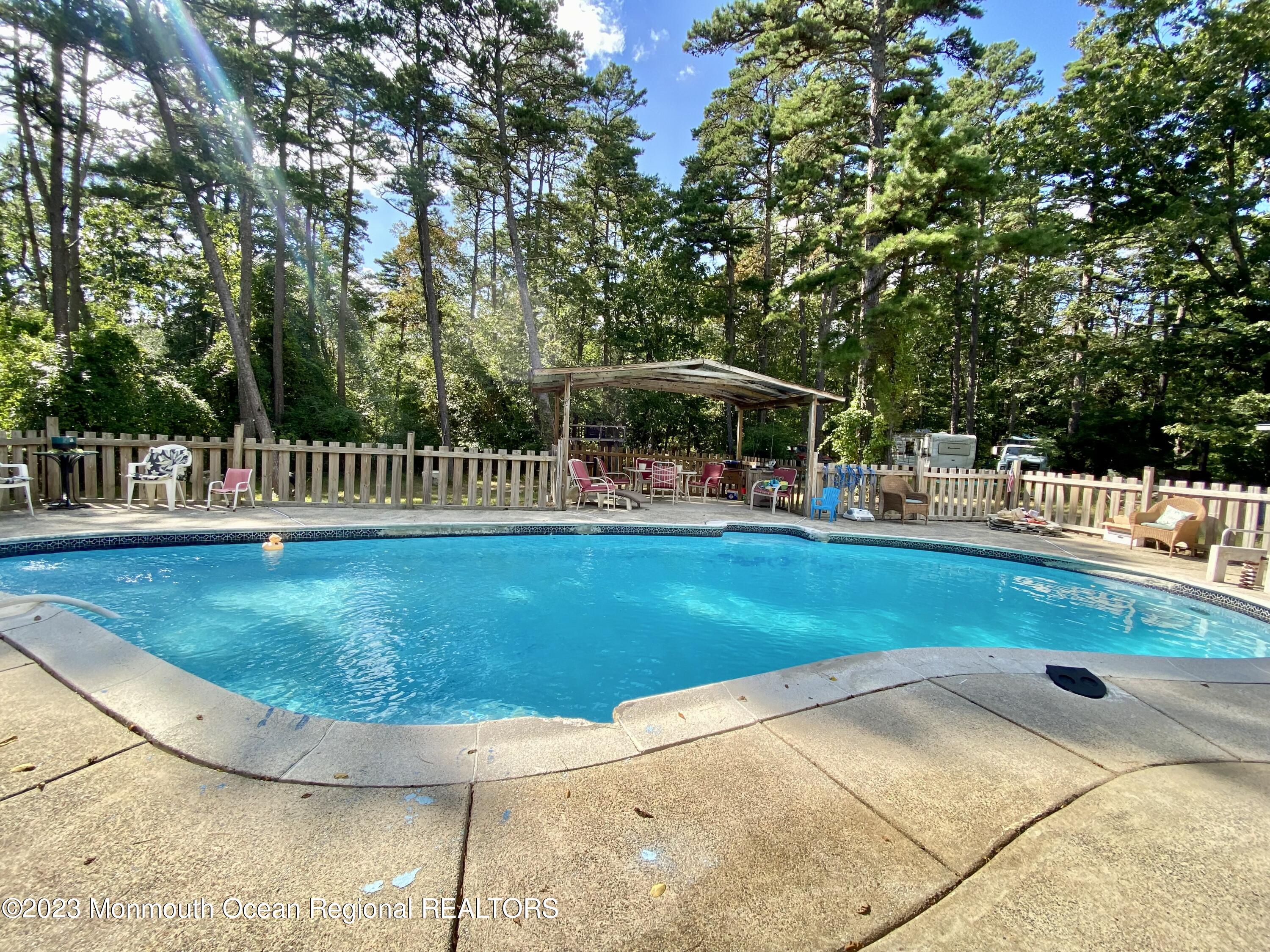113 Maple Avenue Tuckerton, NJ 08087 - Photo 50 of 69 a view of a swimming pool with a sitting space