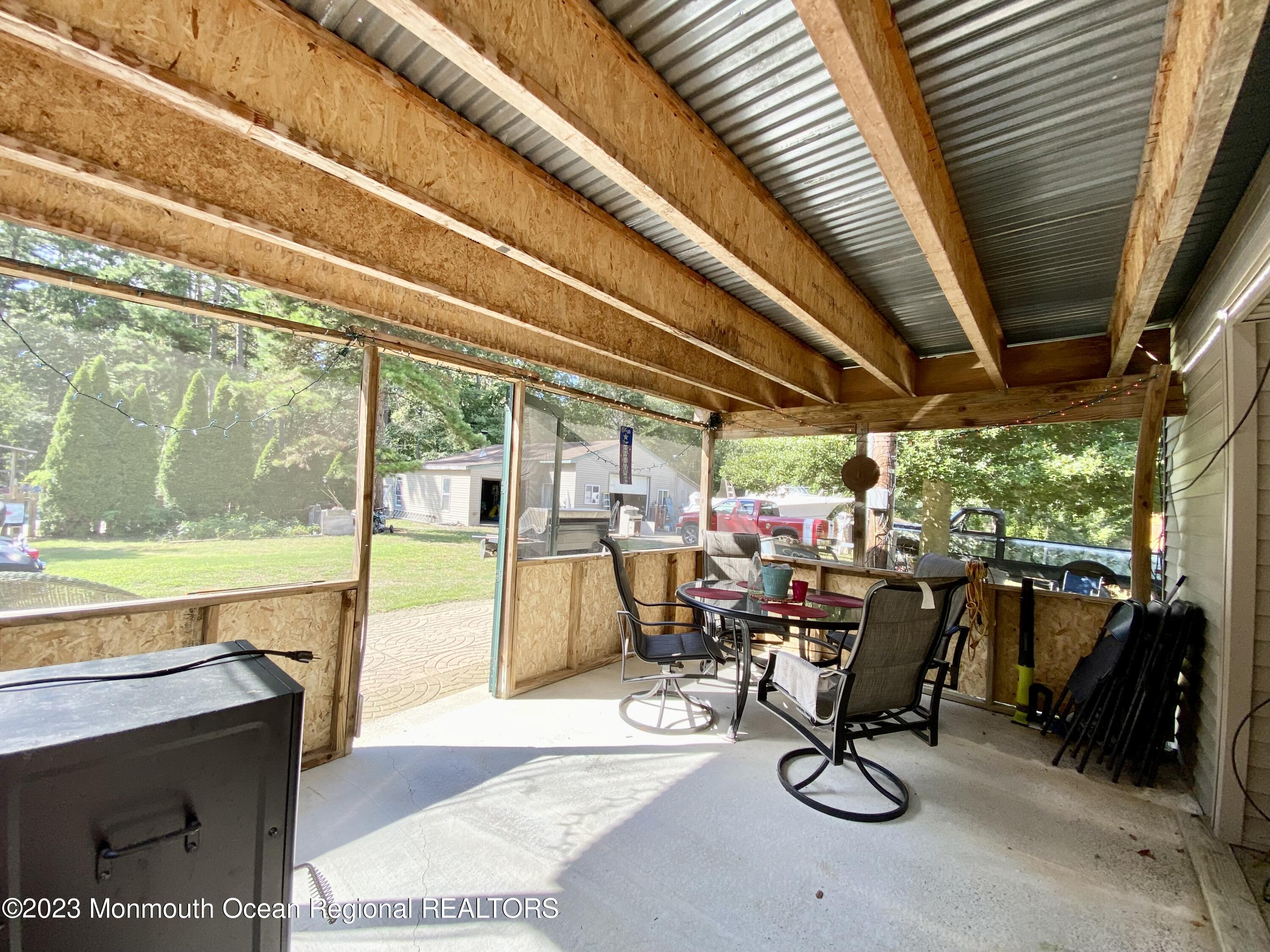113 Maple Avenue Tuckerton, NJ 08087 - Photo 62 of 69 a view of a swimming pool with chairs in front of it