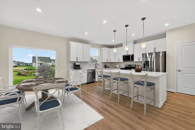 a view of kitchen with wooden floor