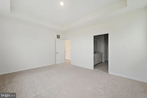 a bathroom with double vanity sinks and a mirror