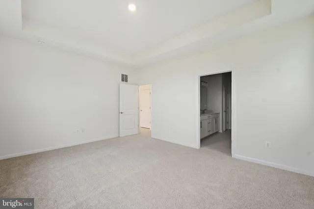 a bathroom with double vanity sinks and a mirror