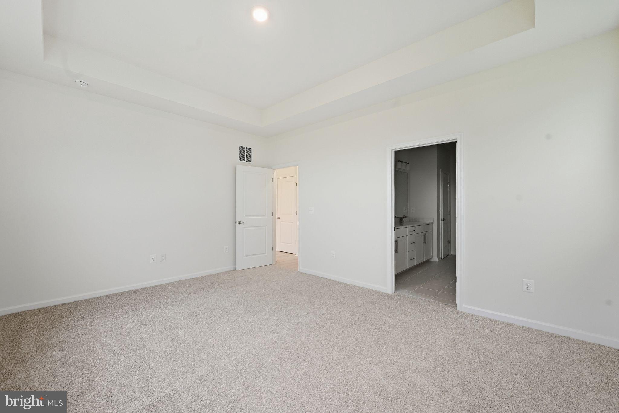 25013 Cypress Court Lewes, DE 19958 - Photo 18 of 24 an empty room with an entryway