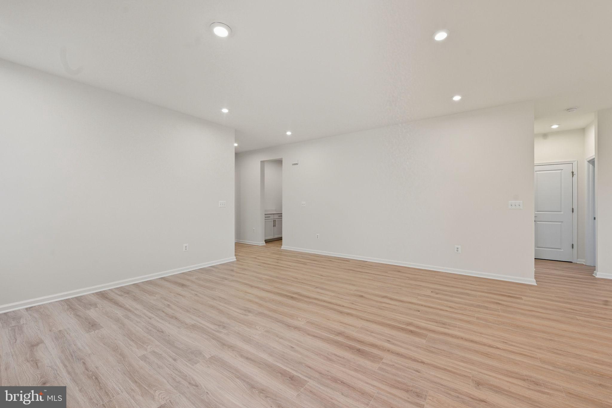 25013 Cypress Court Lewes, DE 19958 - Photo 10 of 24 a view of an empty room with wooden floor and closet