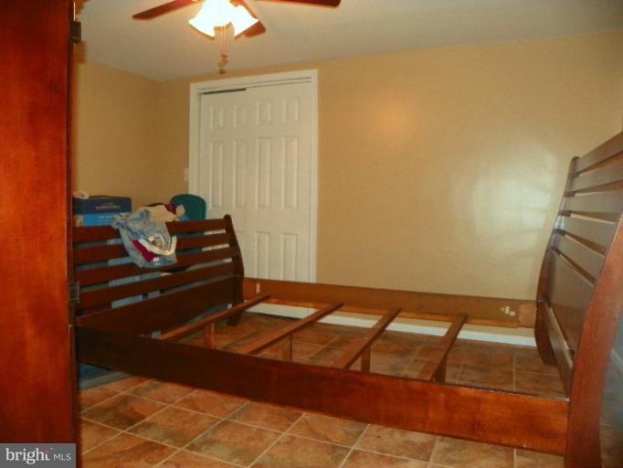 187 Inlet Drive Pasadena, MD 21122 - Photo 13 of 29 a view of a room with wooden floor