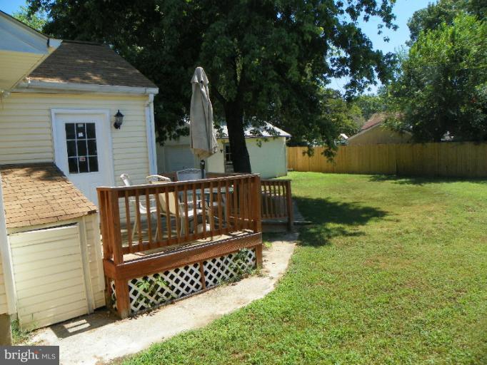 187 Inlet Drive Pasadena, MD 21122 - Photo 18 of 29 a view of a wooden deck with a yard