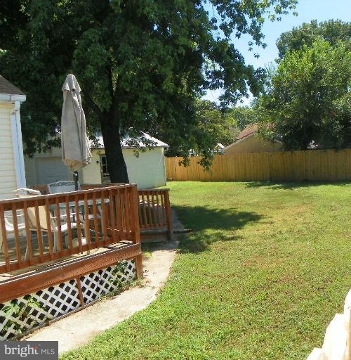 187 Inlet Drive Pasadena, MD 21122 - Photo 27 of 29 a view of a bench in the garden