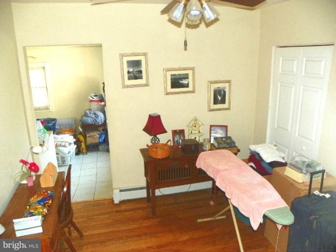 187 Inlet Drive Pasadena, MD 21122 - Photo 4 of 29 a living room with furniture and a table