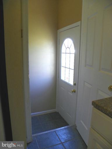 187 Inlet Drive Pasadena, MD 21122 - Photo 10 of 29 a view of entryway with wooden floor