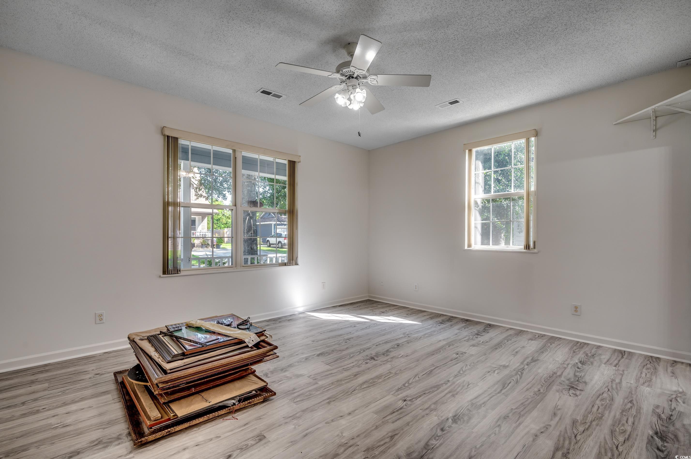 4261 Brook Drive Murrells Inlet, SC 29576 - Photo 19 of 39 Empty room featuring a textured ceiling, ceiling f