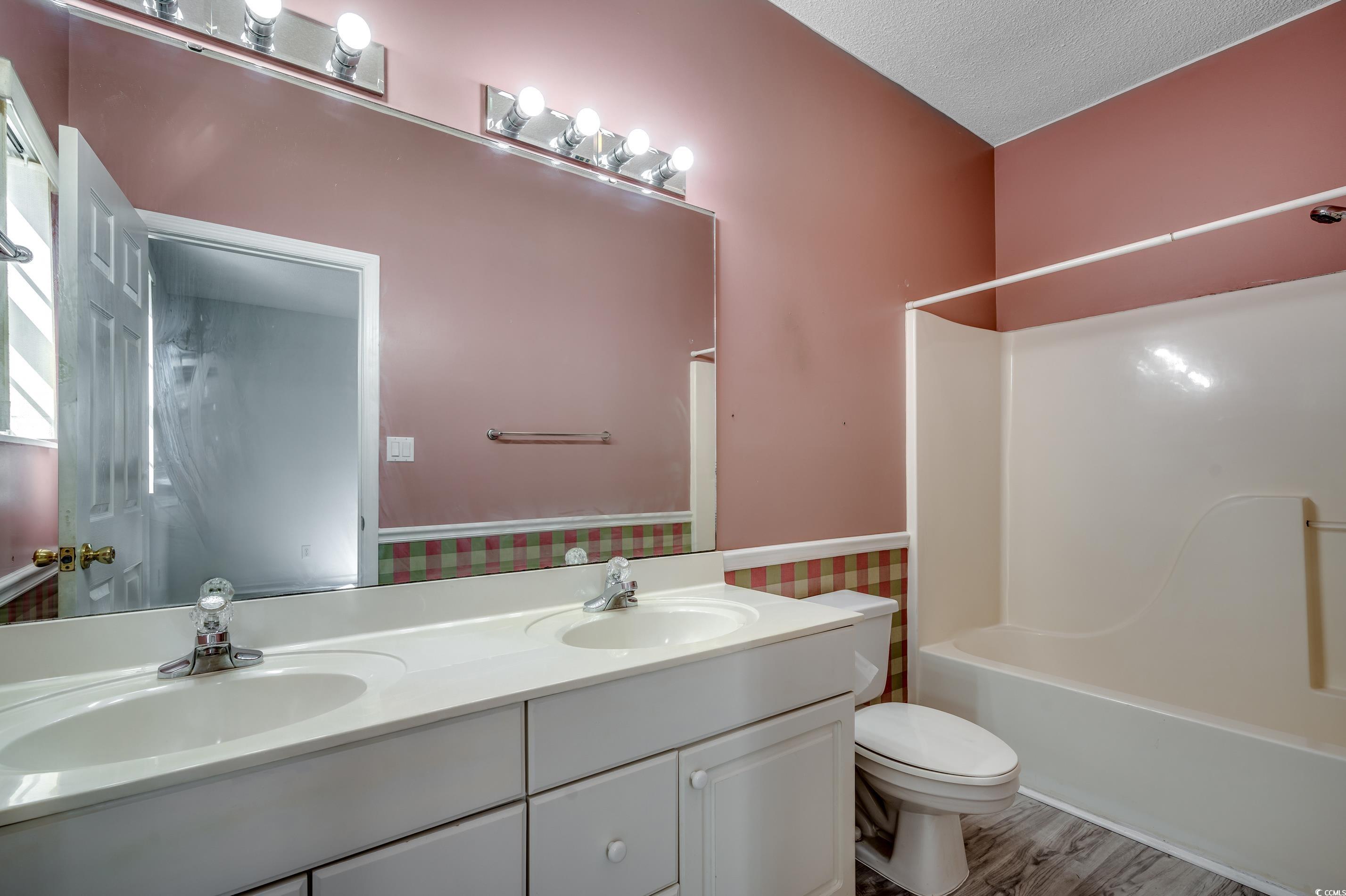 4261 Brook Drive Murrells Inlet, SC 29576 - Photo 22 of 39 Full bathroom with wood-type flooring, a textured