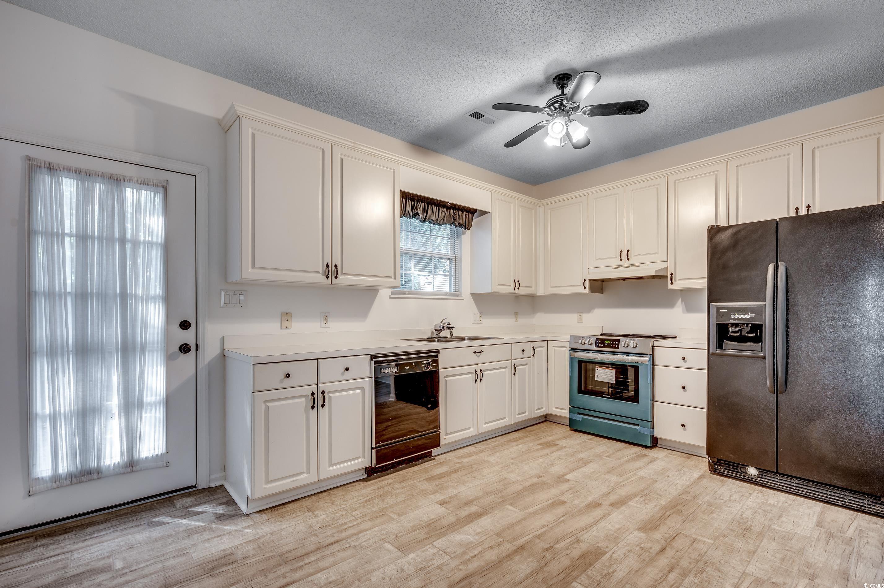 4261 Brook Drive Murrells Inlet, SC 29576 - Photo 10 of 39 Kitchen with light hardwood / wood-style flooring,