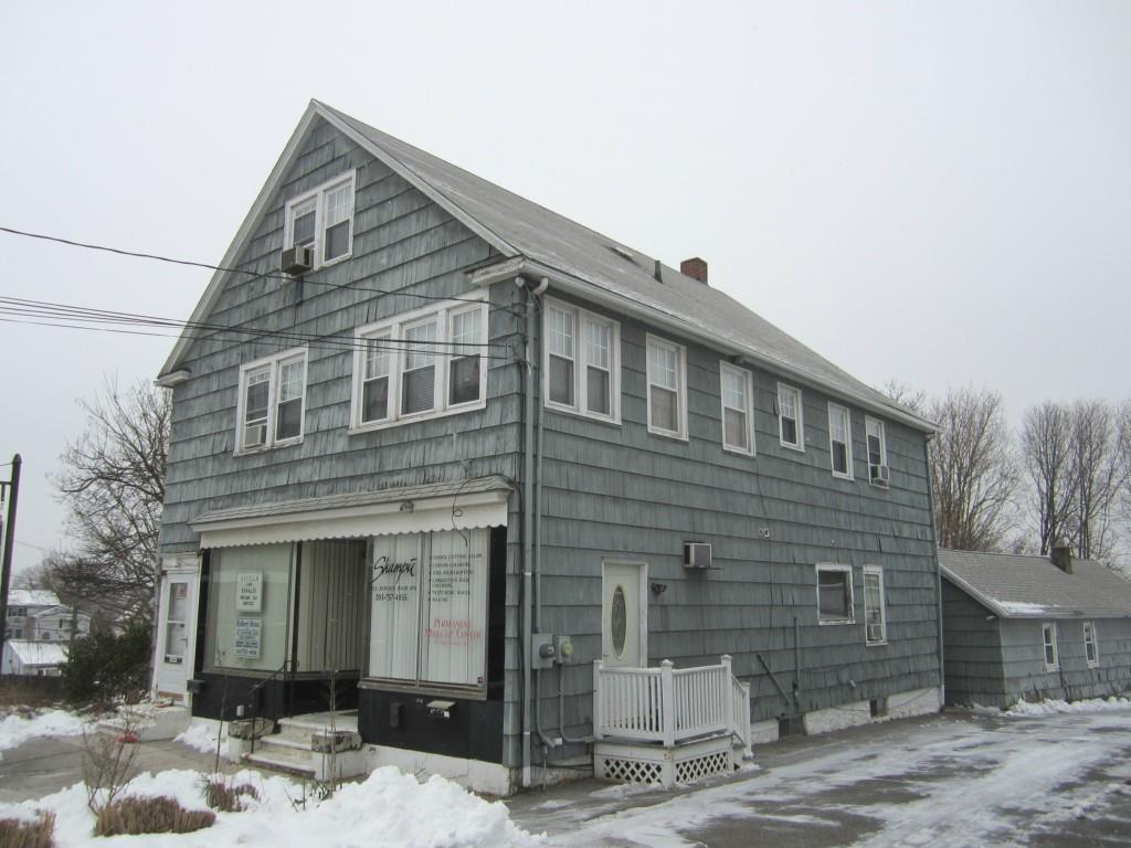 1431 Bank Street Waterbury, CT 06708 - Photo 1 of 1 a front view of a house with a yard