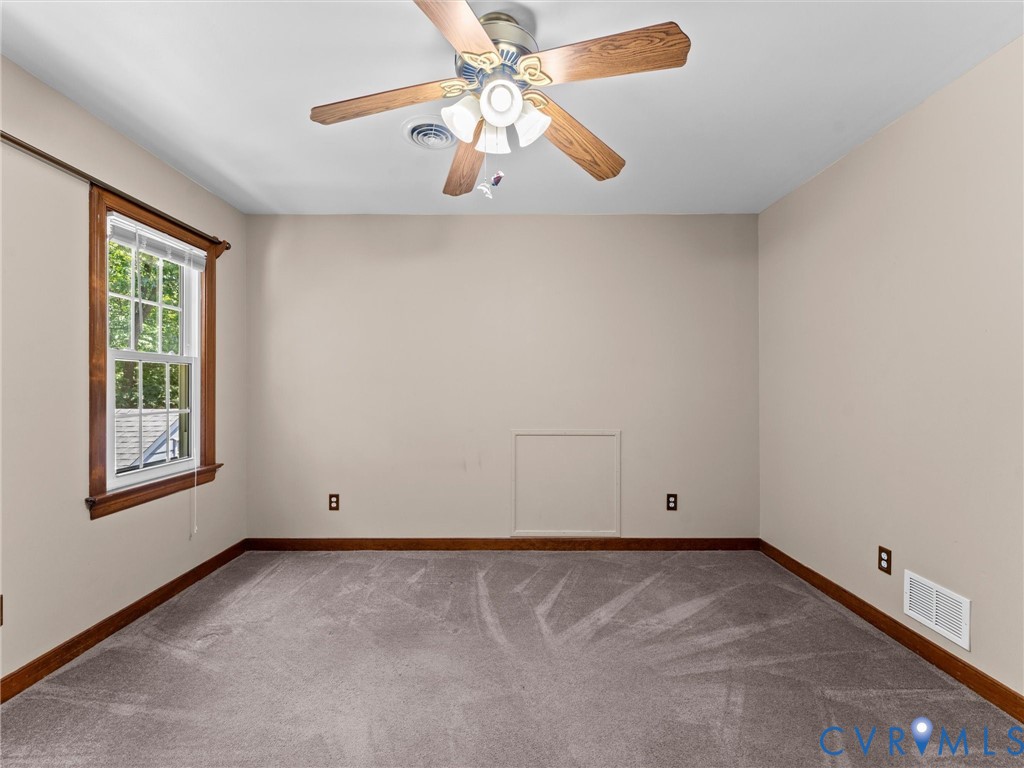 3524 Ludgate Road Chester, VA 23831 - Photo 24 of 44 Room featuring neutral wall tones, wood-finish tri