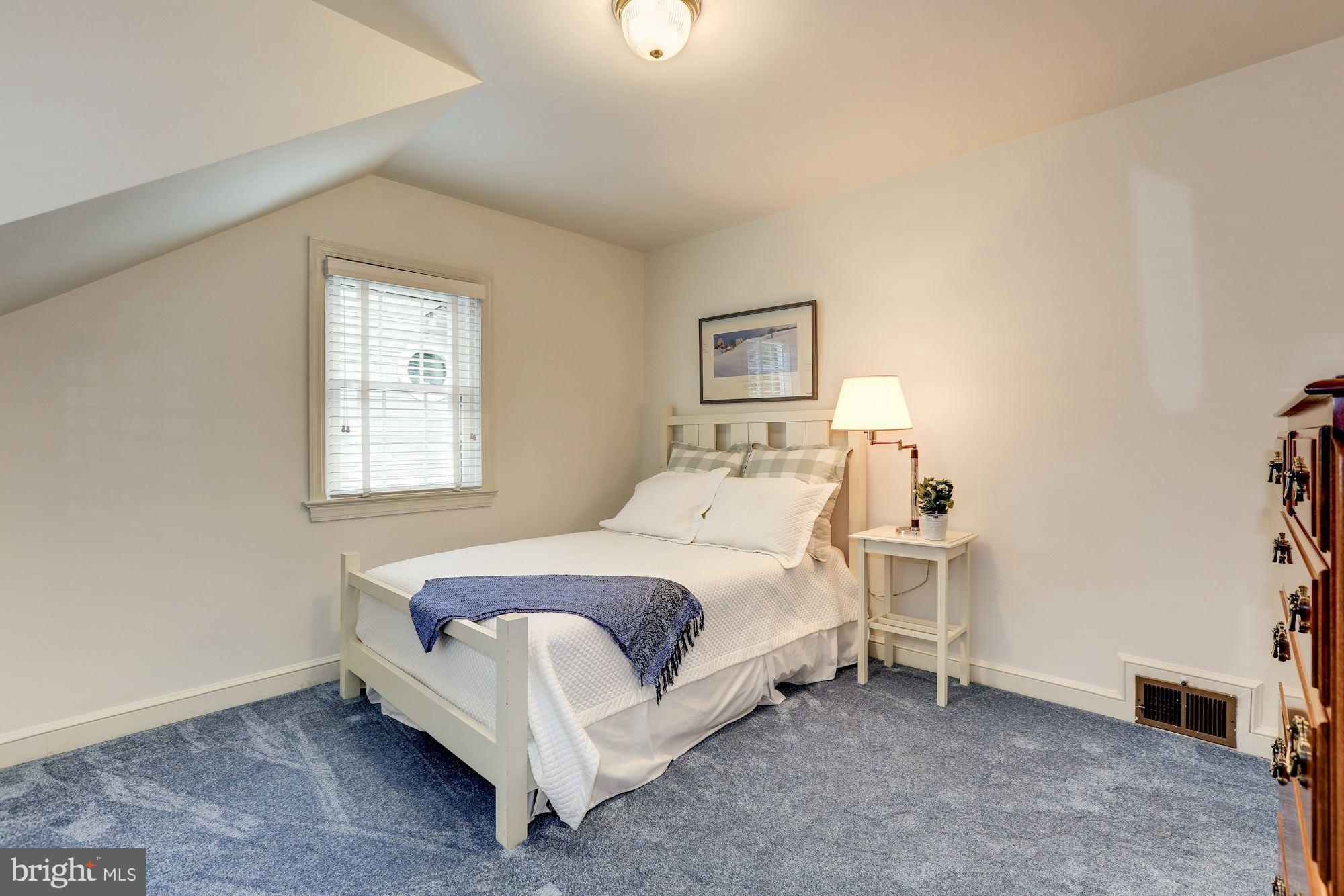 7105 Fairfax Road Bethesda, MD 20814 - Photo 13 of 17 a bedroom with a bed and a window