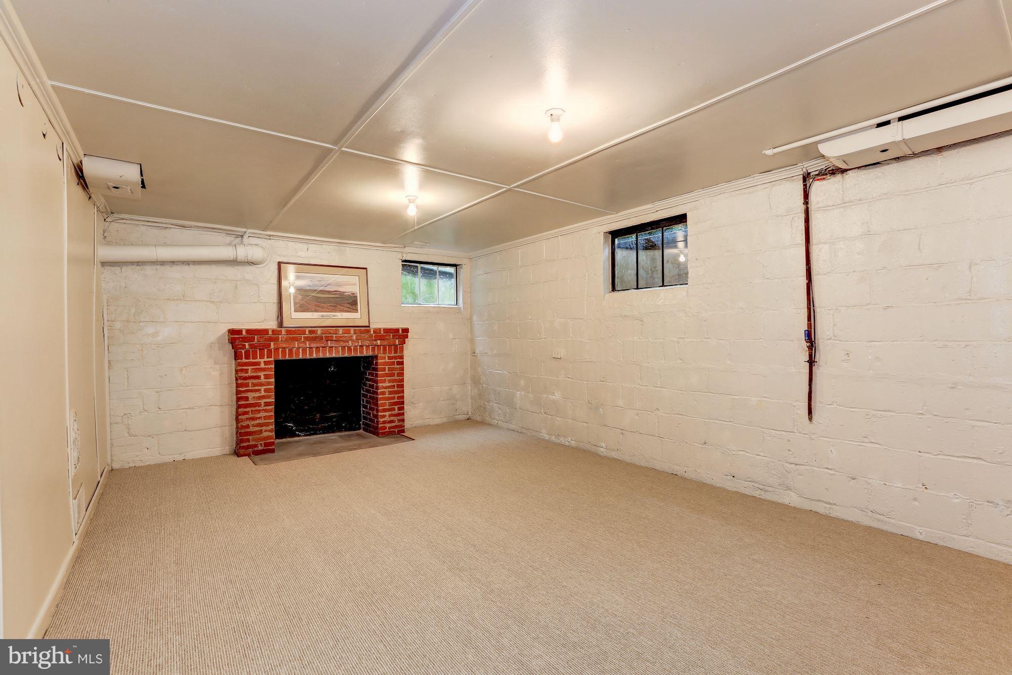 7105 Fairfax Road Bethesda, MD 20814 - Photo 15 of 17 a view of empty room with a fireplace