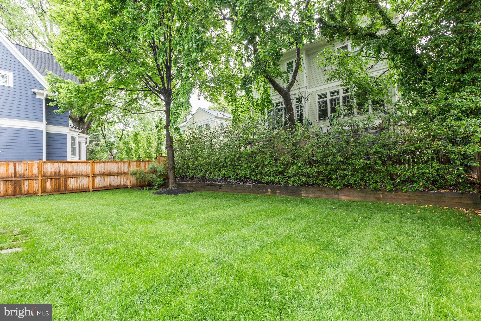 7105 Fairfax Road Bethesda, MD 20814 - Photo 17 of 17 a backyard of a house with lots of green space