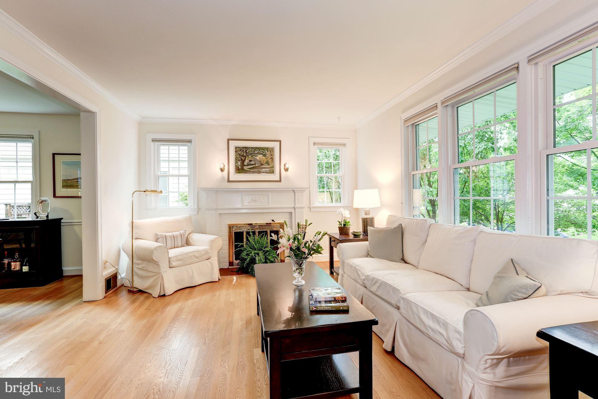 7105 Fairfax Road Bethesda, MD 20814 - Photo 4 of 17 a living room with furniture and a fireplace
