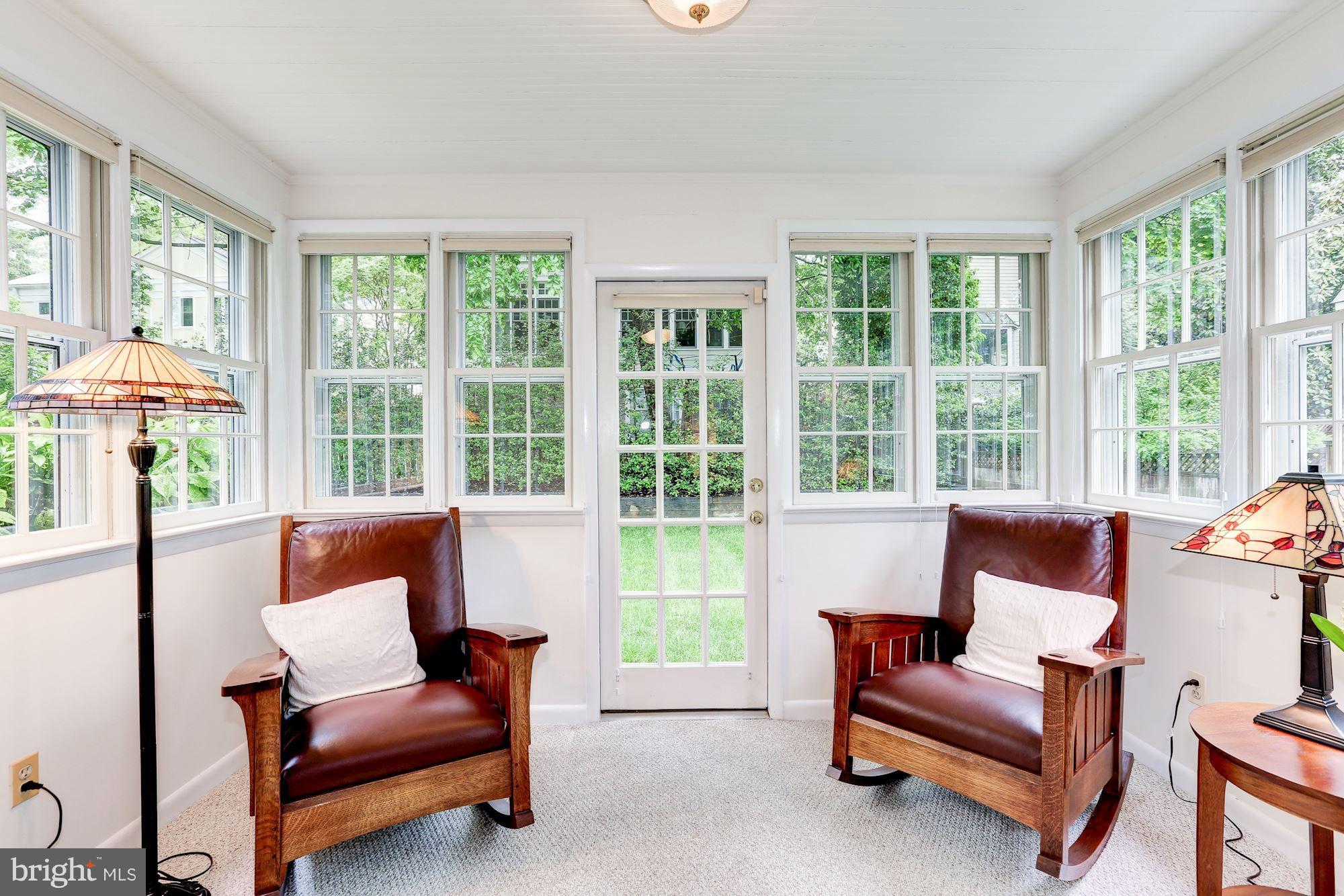 7105 Fairfax Road Bethesda, MD 20814 - Photo 6 of 17 a living room with furniture and a large window