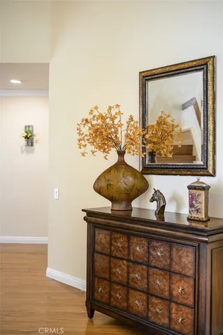 a room with a wooden floor and wall painting